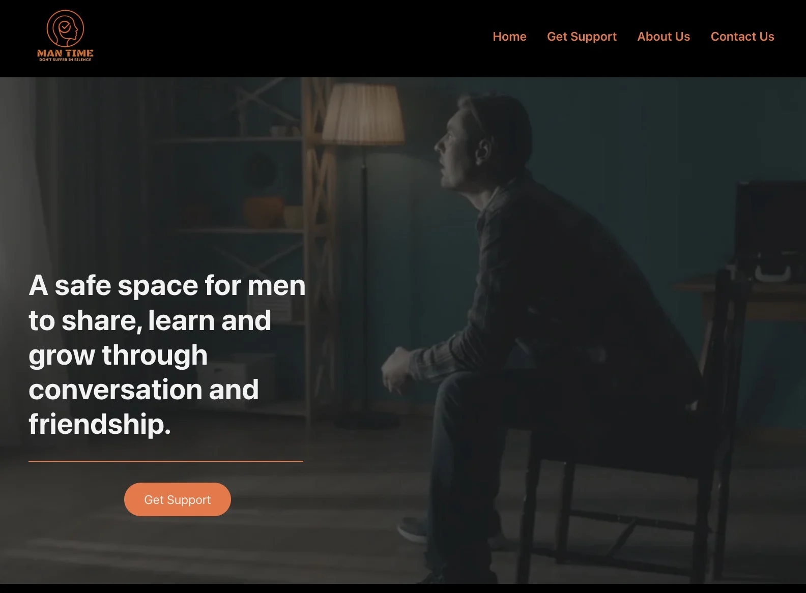 Homepage of Man Time website showing a man seated in a dimly lit room with text promoting a safe space for men to grow through conversation and friendship.